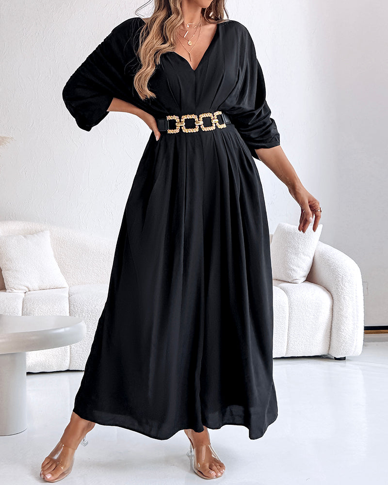 Deep V-neck jumpsuit with ruched sleeves and waist ties in a sleek, elegant style.