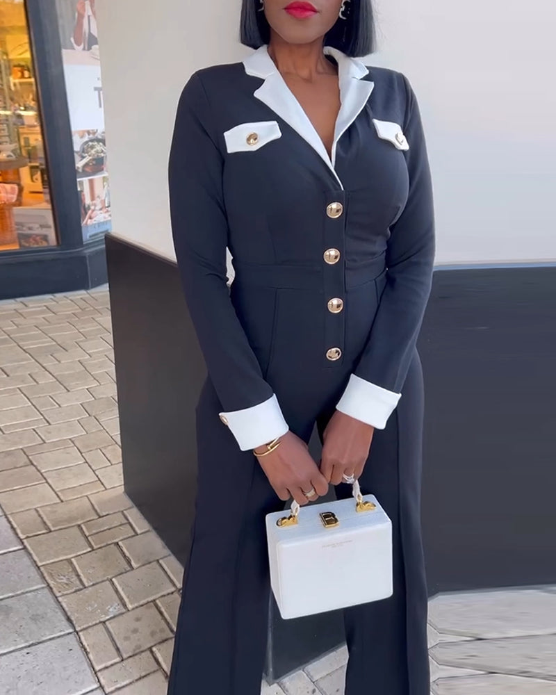 A colorblock wide leg jumpsuit with metal buttons, white cuffs, collar, and pockets.