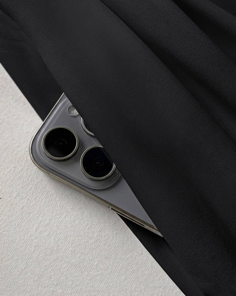 Deep V-Neck Jumpsuit with ruched sleeves and waist ties.