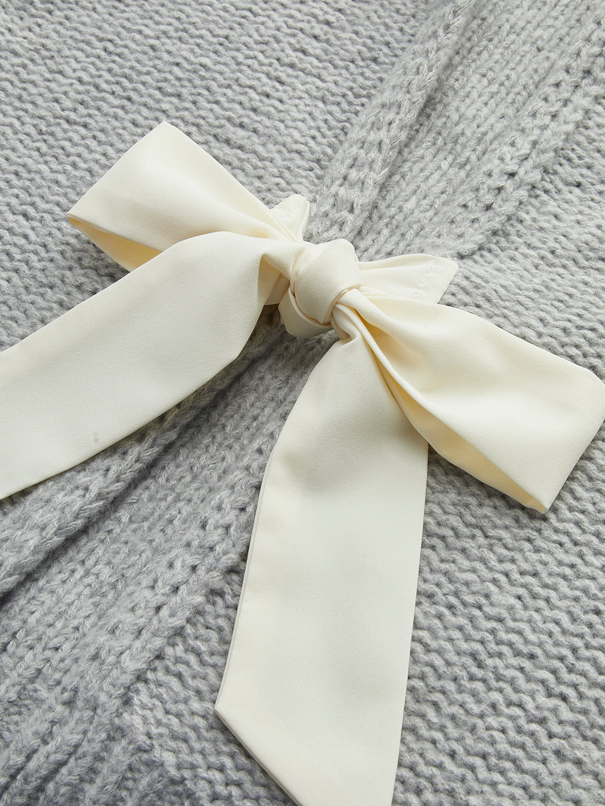 Crew Neck Bow Knit Top with Long Sleeves and Ribbed Texture