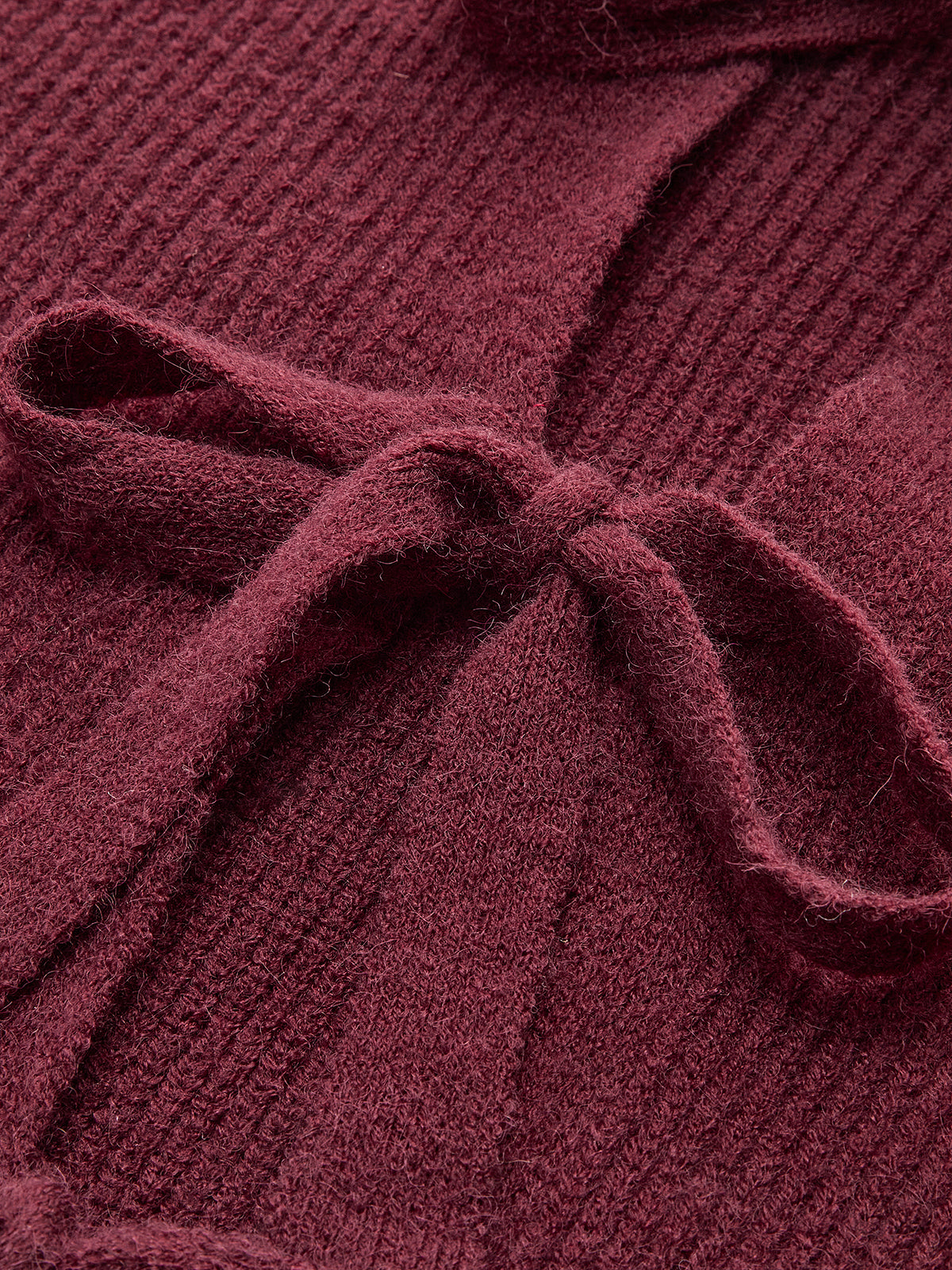 KOAD'CLO lace-trimmed ribbed cardigan with front bow and matching knit tie.