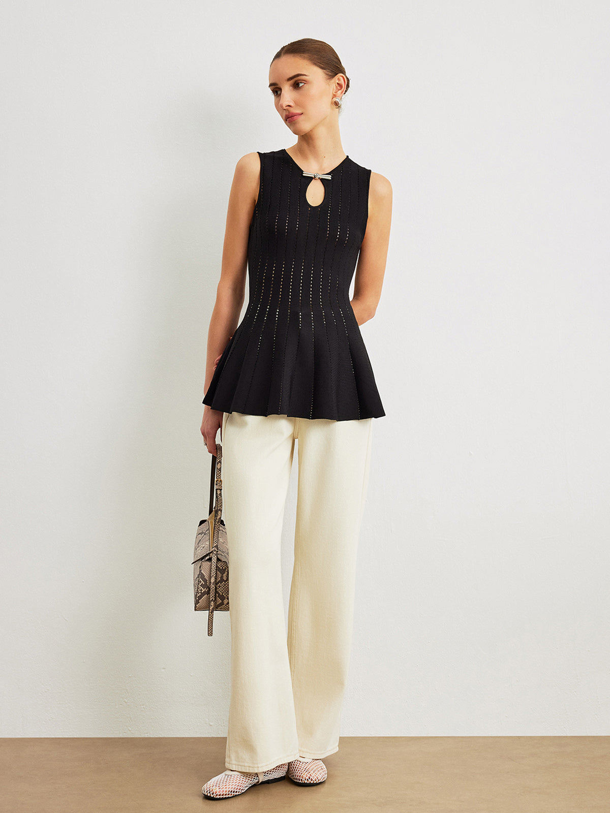 Semi-Sheer Knit Peplum Top with Bow Detail and Ruffled Sleeves