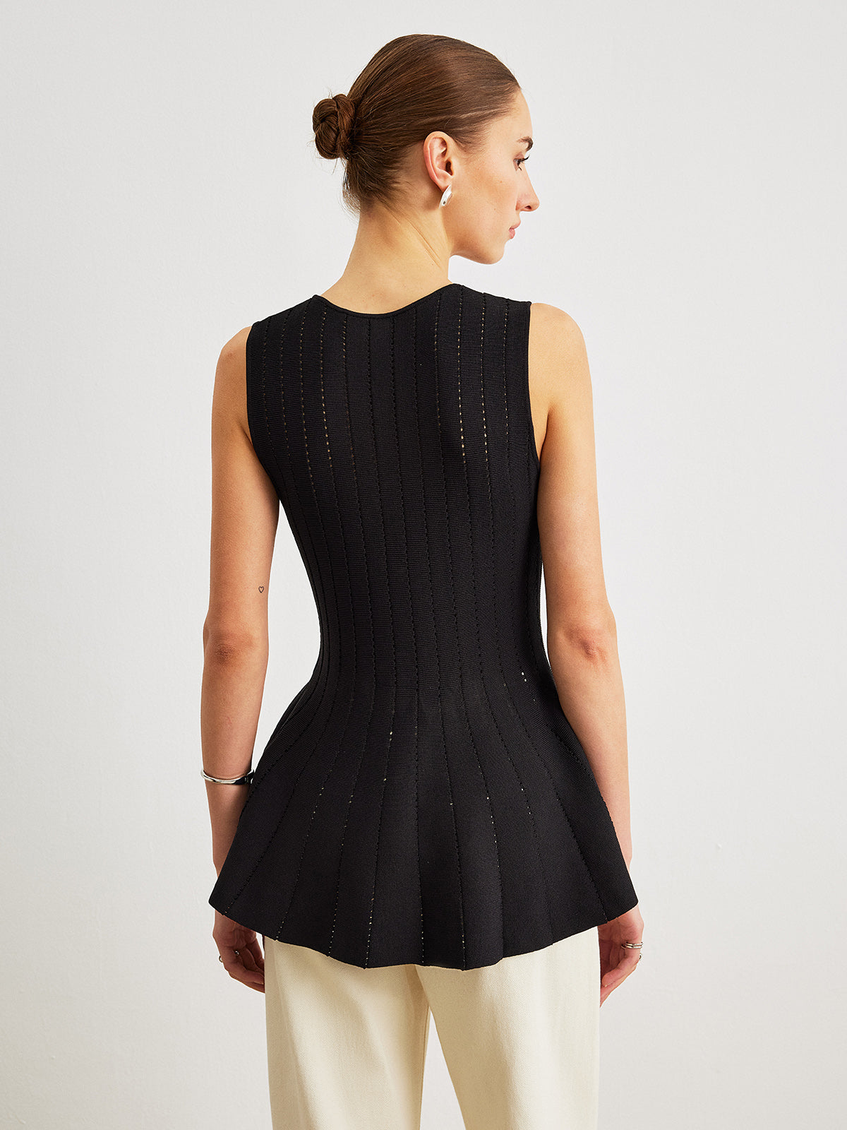 Semi-Sheer Knit Peplum Top with Bow Detail and Ruffled Sleeves