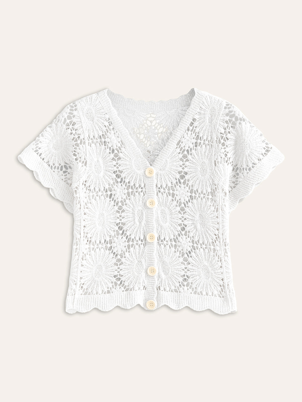 White crochet cardigan with floral pattern, short sleeves, V-neck, scalloped edges, cream buttons.