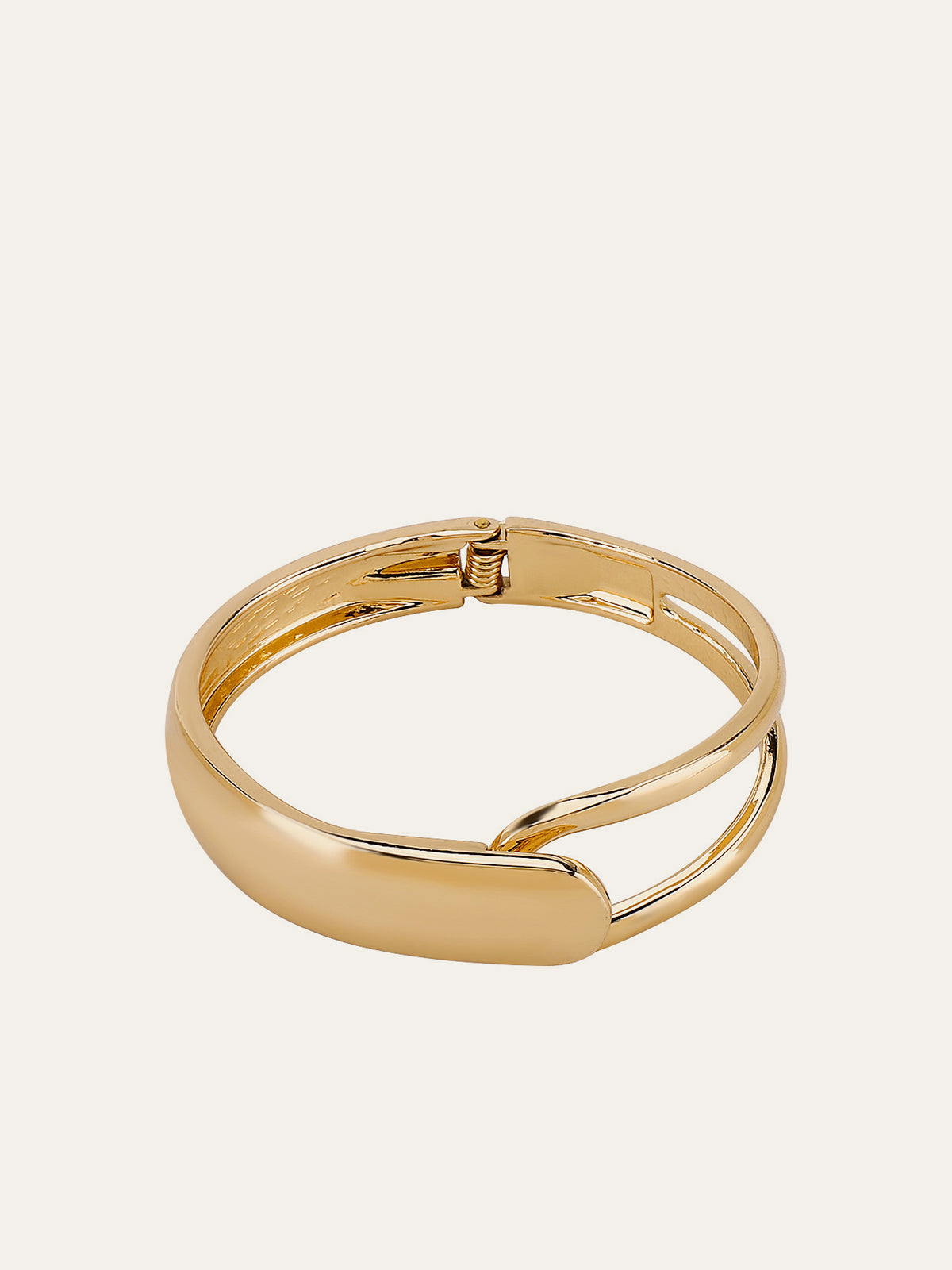 Elegant Gold-Tone Cuff Bracelet with Intricate Design Details
