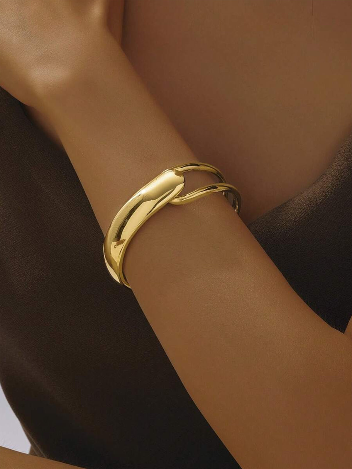 Elegant Gold-Tone Cuff Bracelet with Intricate Design Details