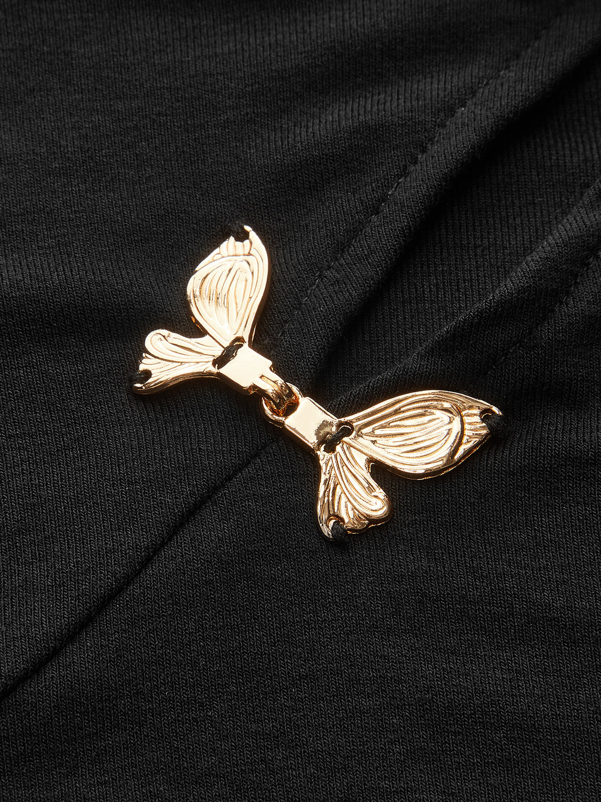 Asymmetric Metal Butterfly Detail Top with Elegant Sleeves and Neckline