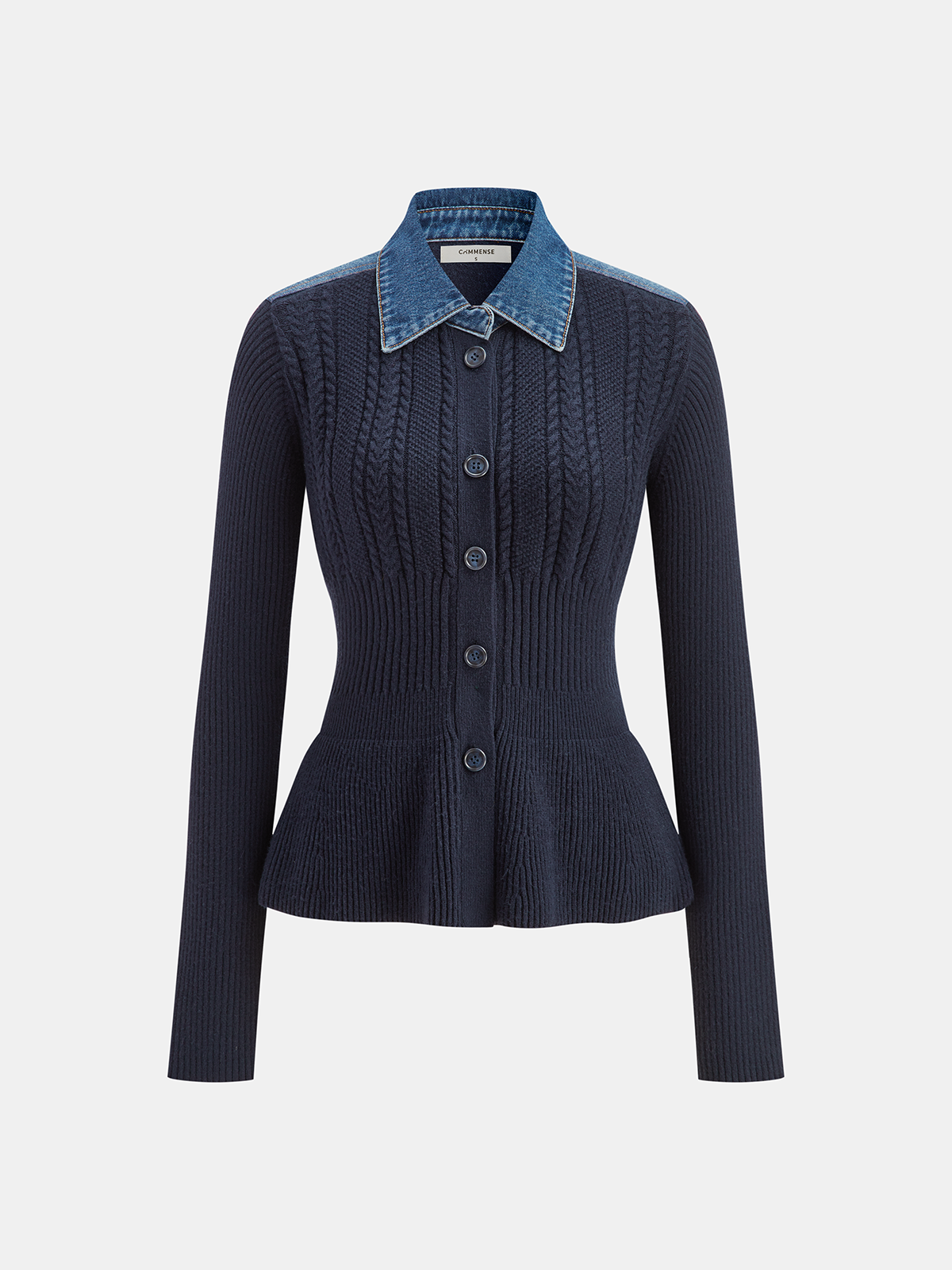 A navy ribbed knit cardigan with denim collar, cable detail, peplum hem, and front buttons.