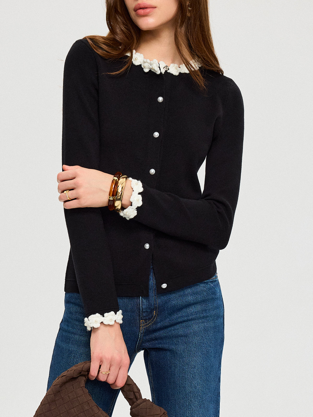KOAD'CLO 3D Floral Embroidered Cardigan featuring elegant pearl buttons, paired with blue jeans.
