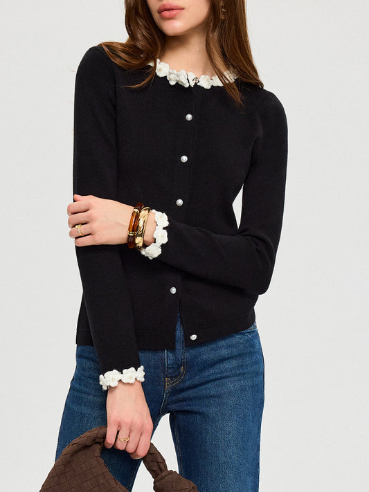 KOAD'CLO 3D Floral Embroidered Cardigan featuring elegant pearl buttons, paired with blue jeans.