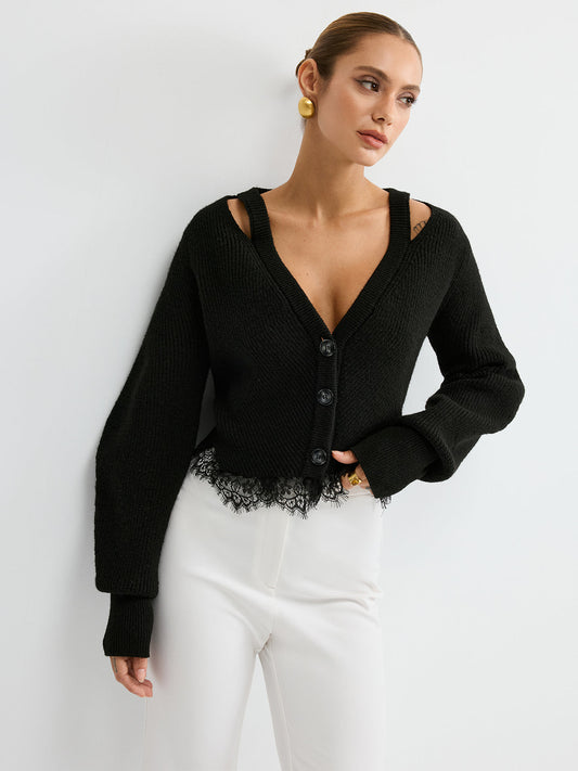A wool blend cardigan with lace hem, paired with high-waisted white pants.