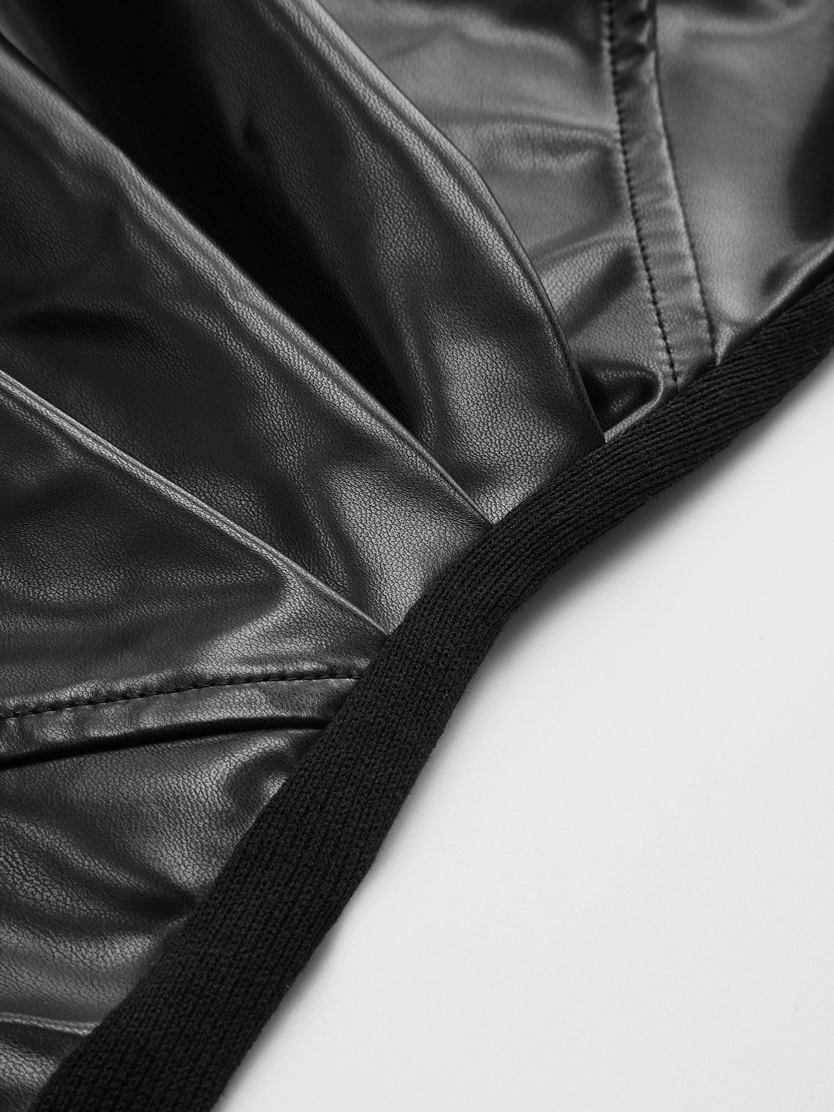 Faux Leather Panel Asymmetric Knit Top with Long Sleeves and Modern Design
