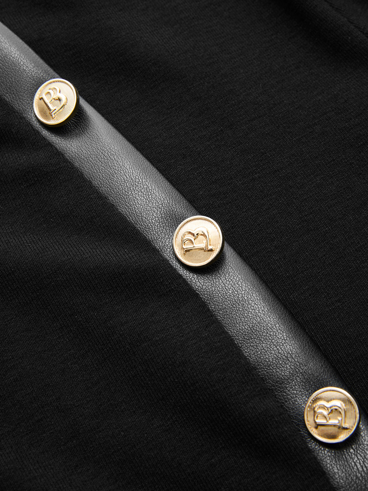 Asymmetric Faux Leather Panel Knit Top with Stylish Modern Detailing