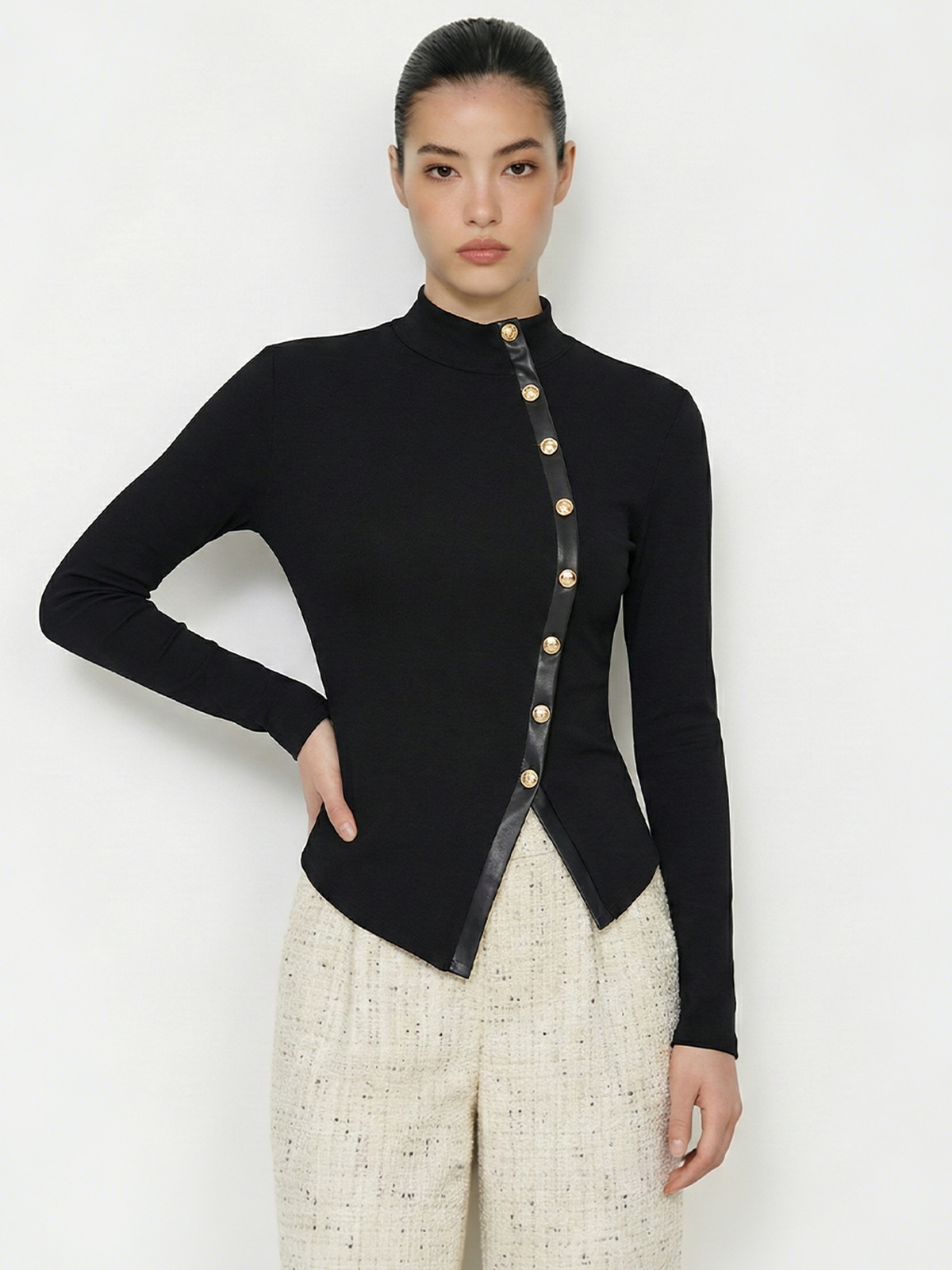Asymmetric Faux Leather Panel Knit Top with Stylish Modern Detailing