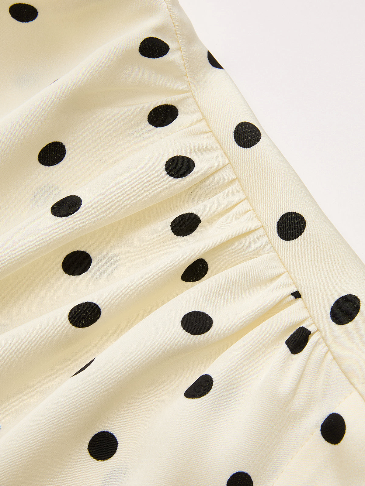 Polka Dot Sleeveless Ruched Blouse with Tie-Back Detail