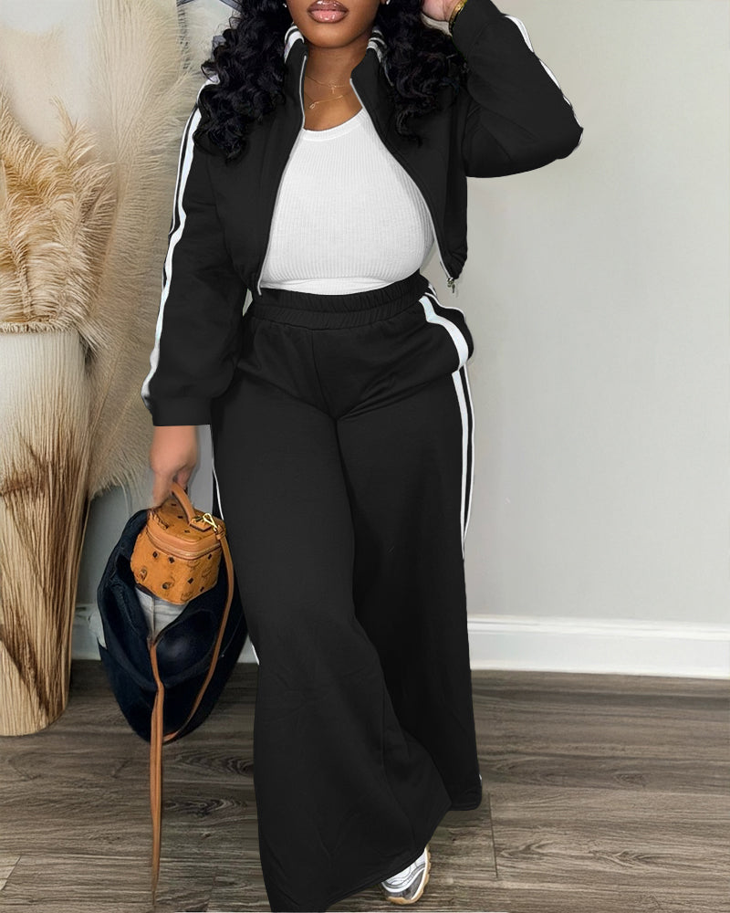 zip crop jacket with wide-leg pants and white ribbed top.